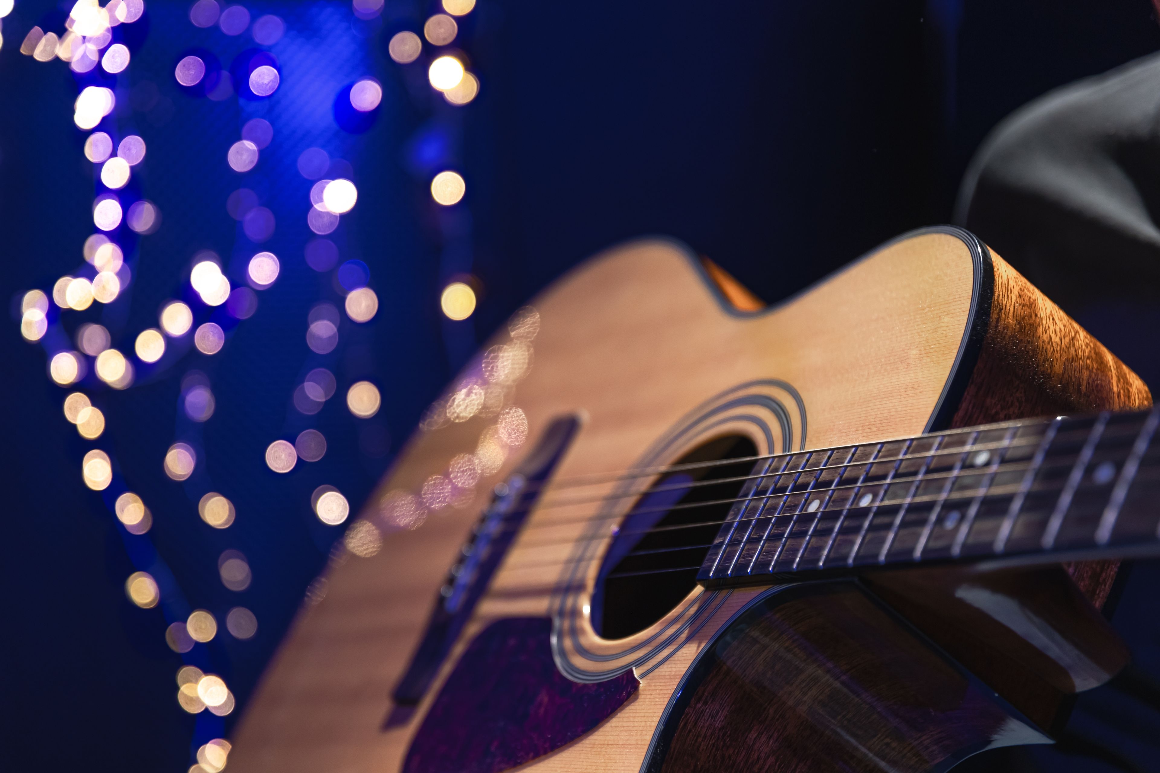 acoustic guitar with twinkling lights